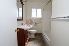 Longview apartment for rent - A bathroom with a toilet, sink, and bathtub.