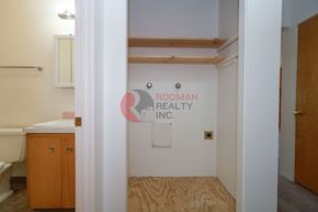 Longview apartment for rent - A room with a wooden floor and a sign that says Rodman Realty Inc.