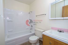 Longview apartment for rent - A bathroom with a toilet, sink, and bathtub.