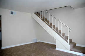 Glendora apartment for rent - a staircase in a home with a carpeted floor