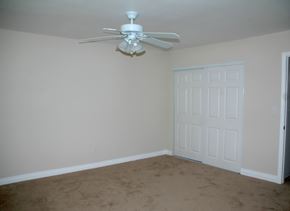 Glendora apartment for rent - an empty room with a ceiling fan and a door