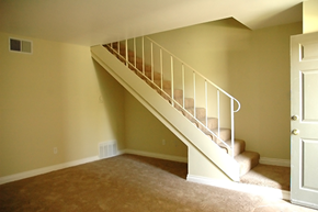 Glendora apartment for rent - the bottom of a staircase in a home with a carpeted floor