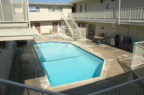 Glendora apartment for rent - an aerial view of a swimming pool and a building with a staircase
