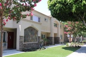 Glendora apartment for rent - the front of a building with a lawn and trees