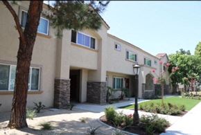 Glendora apartment for rent - a house with a yard and a tree in front of it