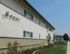 West Covina apartment for rent - a white building with a sign on the side of it