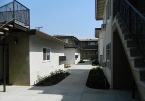 West Covina apartment for rent - a walkway between some buildings with stairs