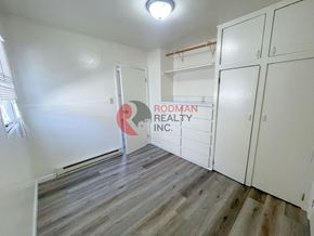 Kelso apartment for rent - A room with Rodman Realty Inc. sign on the wall.