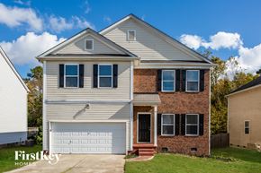Charlotte house for rent - a white house with a white garage door