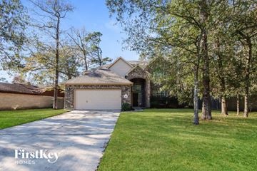 Crosby house for rent - a house with a driveway and a garage door