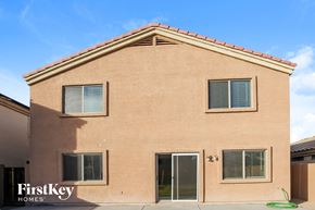 Buckeye house for rent - a brick building with a glass door and window