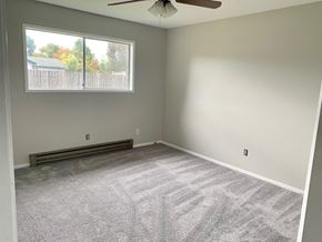 Longview house for rent - an empty room with carpet and a window