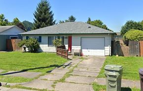 Longview house for rent - a house with a driveway and a garage door