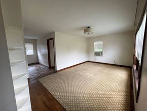 Castle Rock apartment for rent - an empty living room with a rug and a window