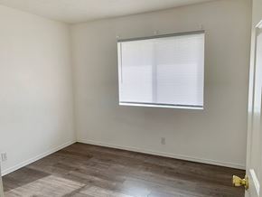 Castle Rock apartment for rent - A room with a window and wooden flooring.
