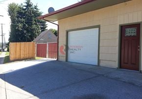 Longview house for rent - A building with a sign that says "Brody Realty Inc." on the garage door.