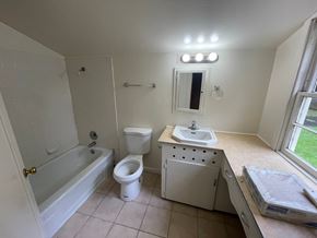 Longview house for rent - an empty bathroom with a sink toilet and bath tub
