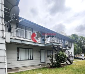 Longview apartment for rent - A white building with a red logo on the side and the words "BRODMAN BEAUTY & FITNESS" written on it.