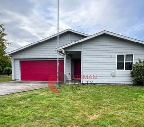 Longview house for rent - A two-story house with a red garage door and a sign that reads "ODMAN REALTY INC."