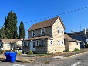 Kelso apartment for rent - a house with a blue trash can in front of it