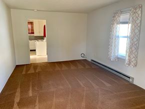 Longview house for rent - a empty living room with a wood floor and a window