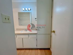 Longview apartment for rent - A white bathroom with a sink and mirror.