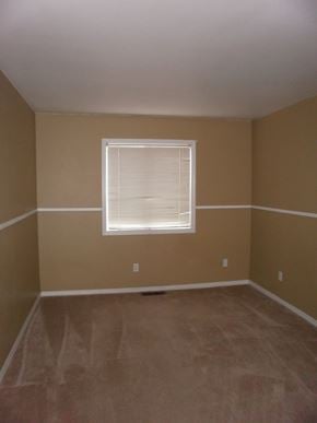 Longview house for rent - an empty room with beige walls and a window