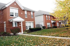 St. Louis apartment for rent - a brick house with a yard in front of it