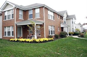 St. Louis apartment for rent - a large brick house with a lawn in front of it
