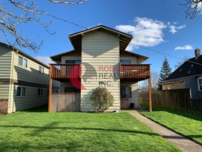 Longview apartment for rent - A house with a red sign that says "BROOKS PLAZA" on it.