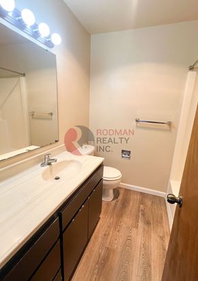 Longview apartment for rent - A bathroom with a white sink and a toilet.