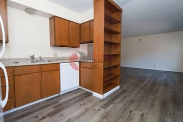 Longview apartment for rent - A kitchen with wooden cabinets and a white countertop.
