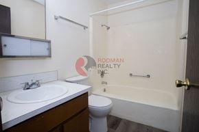 Longview apartment for rent - A bathroom with a toilet, sink, and bathtub.