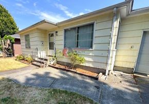 Longview house for rent - A house with a sign that says "REALTY" on the front window.