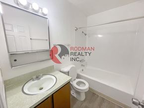 Longview apartment for rent - A bathroom with a sink, toilet, and bathtub.