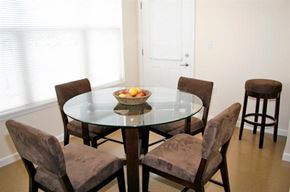 St. Louis apartment for rent - a dining room table with a bowl of fruit on it