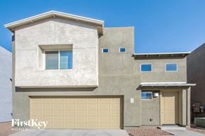 Tucson house for rent - a new house with a garage door in front of it