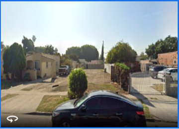 Los Angeles apartment for rent - a car driving down a street in a neighborhood