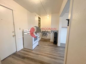 Kelso apartment for rent - A room with a white door and a sign that says "RODMAN REALTY INC."