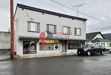 Kelso apartment for rent - A building with a sign that says Rodman Realty.