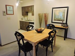 New Berlin apartment for rent - a dining room with a wooden table and chairs