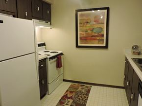 New Berlin apartment for rent - a kitchen with white appliances and a painting on the wall