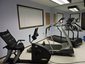 New Berlin apartment for rent - a gym with a row of exercise machines