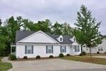 Rocky Mount apartment for rent - A white house with a grey roof and a tree in front.