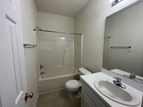 Rocky Mount apartment for rent - A white bathroom with a toilet, sink, and shower.