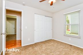 St Peters house for rent - a bedroom with a closet and a door to a hallway