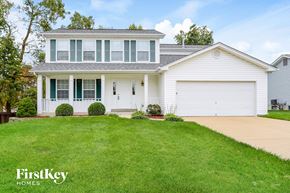 St Charles house for rent - a white house with a lawn in front of it