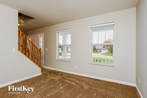 St Charles house for rent - the living room and entryway of a house with carpeted floors