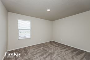 St Hedwig house for rent - a bedroom with carpet and a window
