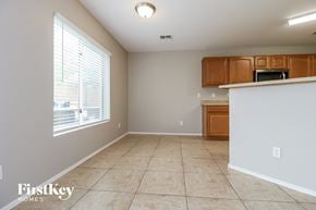 Buckeye house for rent - a kitchen and dining room with a large window